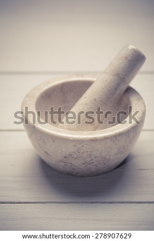 Mortar and pestle  on wooden background