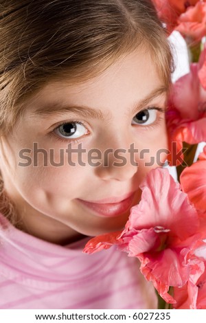 The girl touches a gentle flower