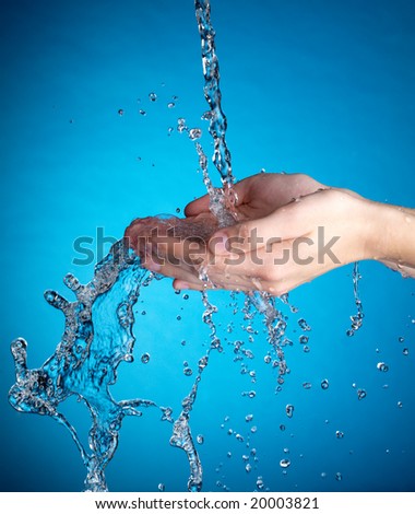 Hands and stream of water. Very high resolution.