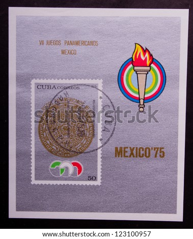 CUBA- CIRCA 1975: A stamp printed in Cuba shows the olympic fire and the emblem of Mexico, circa 1975.
