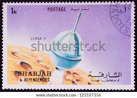 UAE - CIRCA 1972: A stamp printed in UAE shows a spaceship landing on the moon, circa 1972.