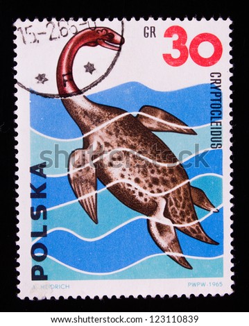 POLAND - CIRCA 1965: A stamp printed in Poland shows an ocean fish in the Mesozoic era,circa 1965