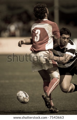Man trying to bring down opponent at the International Rugby 7s 2007 game