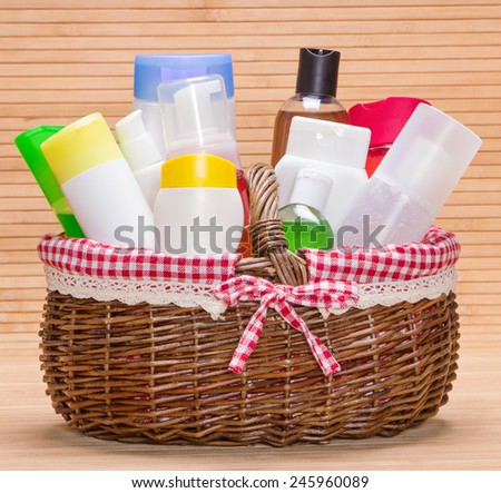 Wicker basket filled with different cosmetic products for body care