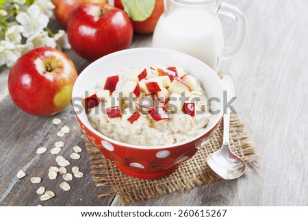 Oatmeal with caramelized apples in the orange bowl