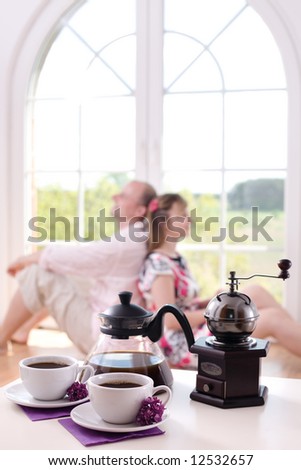 Couple in love at home / focus on the morning coffee