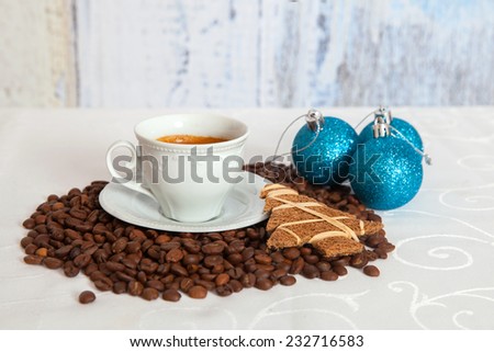 white mug of hot coffee with christmas decorations