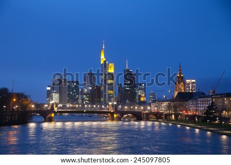 FRANKFURT, GERMANY - JAN 11, 2015: The view of Frankfurt am Mine skyscrapers at dusk time from bridge over Mine river