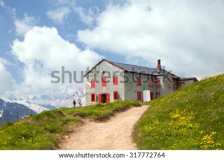 CHAMONIX, FRANCE - JUN 26, 2015: A house in the european Alps at border between France and Switzerland