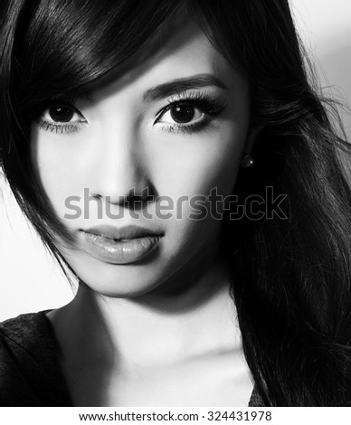 portrait of beautiful young asian woman with clear, flawless skin and perfect make-up