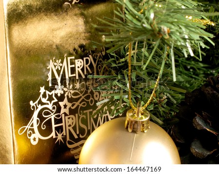 An image showing the spirit of Christmas with a gift in a tree / Merry Christmas