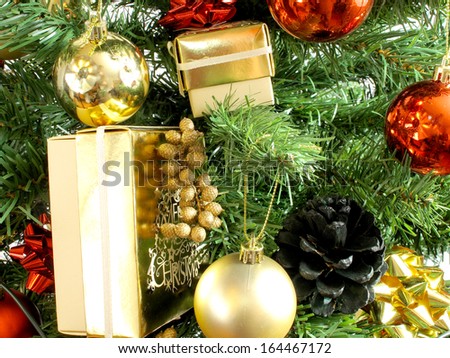 An image showing the spirit of Christmas with Gifts and baubles in a tree / Gifts in a christmas tree