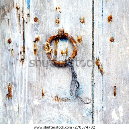 brown  morocco in africa the old wood  facade home and rusty safe padlock
