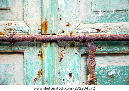 morocco in africa the old wood  facade home and rusty safe padlock