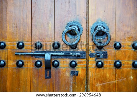 brown  morocco in africa the old wood  facade home and rusty safe padlock