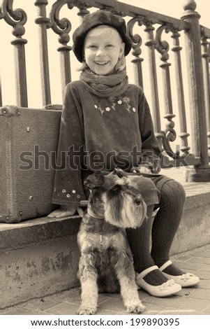 Vintage old photo of a little girl and his dog