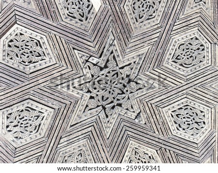 Intricate wood filigree on a gate to the palace of the king of Morocco