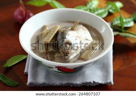 ancient thai food, shrimp paste and coconut milk soup with lotus stem and mackerel