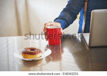 Similar – Image, Stock Photo Architect man having breakfast while working at computer in office