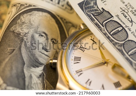 Time and Money. Gold Tone. Close up, - Stock Image
