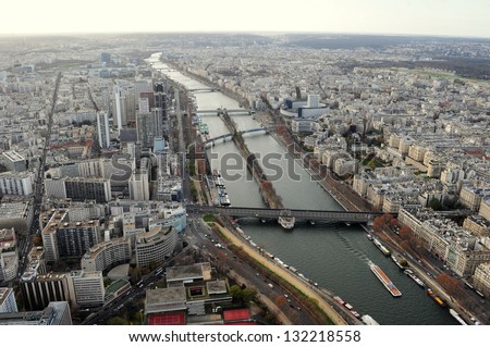 Paris city aerial view from top of Eiffel tower, view of city from sky with lake water and buildings.