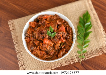 Spicy beef curry. Goan style beef vindaloo. Traditional Indian Lamb or beef curry . spicy Beef curry gravy popular in Kerala Sri Lankan Goa for Appam, Parotta porotta in India.