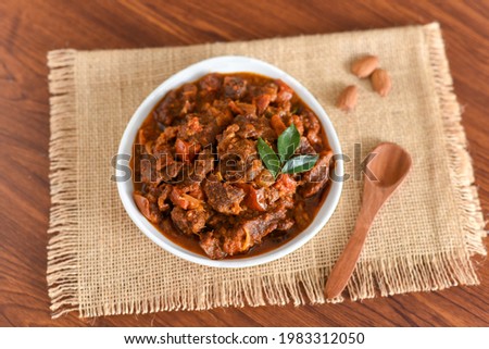 Spicy beef curry. Goan style beef vindaloo. Traditional Indian Lamb or beef curry . spicy Beef curry gravy popular in Kerala Sri Lankan Goa for Appam, Parotta porotta in India.