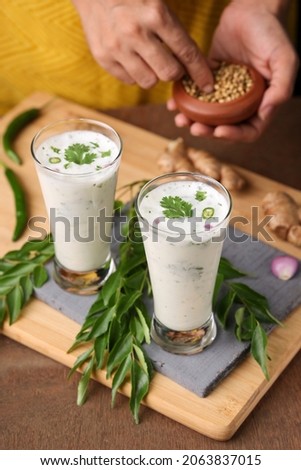Spiced buttermilk chaas  chaach  moru  sambharam  curd lassi  yogurt cool refreshing drink for hot summer in glass , Kerala, India. Flavored Indian buttermilk.	
 Сток-фото © 