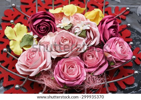 flower vase with beautiful red flowers. artificial flowers isolated on white background