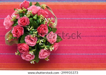 flower vase with beautiful red flowers. artificial flowers isolated on  red background