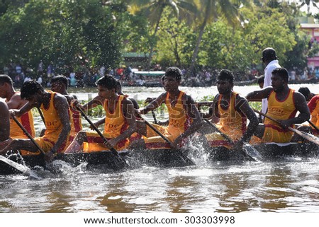 CHAMPAKULAM, INDIA - JULY 01: largest team sport, men wearing traditional dress participate at the Champakulam vallam kali (snake boat race) on July 01, 2015 in Alappuzha, Kerala, India. Festival Onam