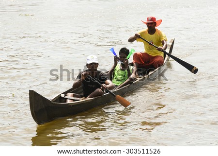 ALLEPPEY, INDIA -JUL 01 : Unidentified people enjoying boat race in the backwaters on July 01, 2015 in Alleppey, Kerala India. People of the region depend on boats for their transporting needs.