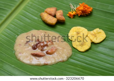 Mithai confectionery desserts of South Asia, India and Sri Lankas. Kerala Deliscious Onam Payasam, banana chips on a leaf, Kheer sweet dish, India  rice pudding broken wheat, vermicelli milk and sugar