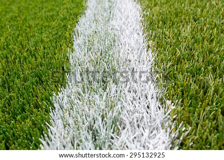 Chalk line on artificial turf soccer or football field , The green artificial grass is brand new