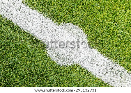 Centre-spot chalk line on artificial turf soccer or football field , The green artificial grass is brand new