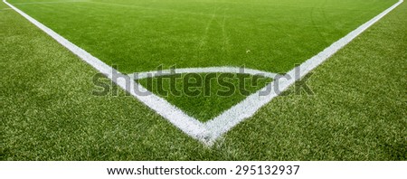 Corner area chalk line on artificial turf soccer or football field , The green artificial grass is brand new
