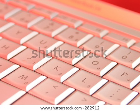Laptop keys lit by red lights