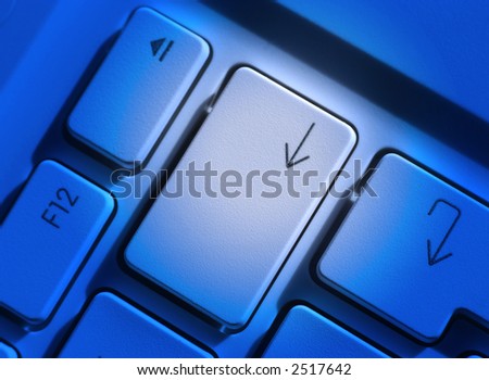 Computer laptop keys with blue lighting for effect