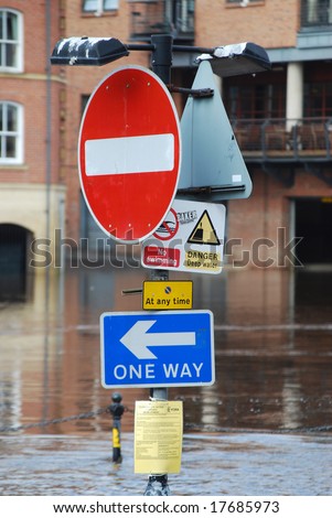 Flooded traffic sign on bank of River Ouse in York
