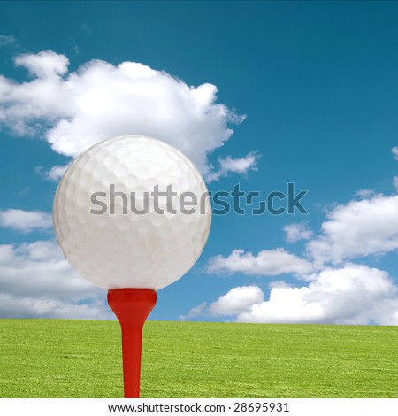 Golf ball and tee with green grass and cloudy sky