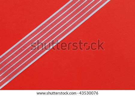 Plain red wrapping paper with silver ribbon