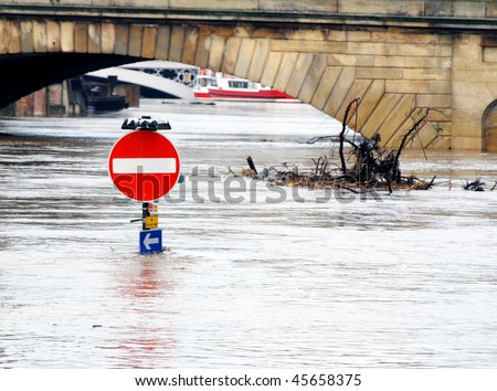 Traffic sign stands underwater during River Ouse floods. York, North Yorkshire, UK.