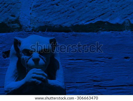 Lighting effect on gargoyle figure toned blue