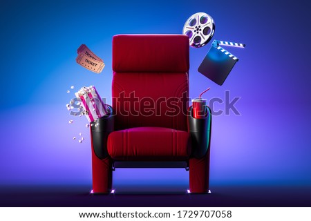 Red Cozy Cinema Armchair With Comfortable Elbows Near Popcorn Bowl, Tickets, Film Reel And Movie Clapper. 3d Rendering