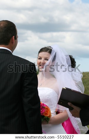 Bride and Groom exchanging wedding vows