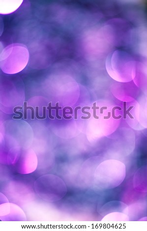 Purple Lights Festive background. Abstract bright background with bokeh defocused purple lights