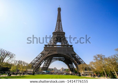 Similar – Image, Stock Photo Under the Eiffel Tower .  With light and shadow . Above me the Great Steel Frame . In the background a skyscraper and many trees.