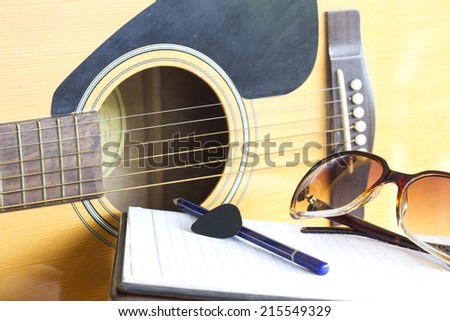 guitar and pencil for create music select focus pick