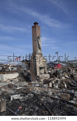 NEW YORK -NOVEMBER 12: Fire destroy around 100 houses during Hurricane Sandy in the flooded neighborhood at Breezy Point in Far Rockaway area  on November 12, 2012 in New York City; NY