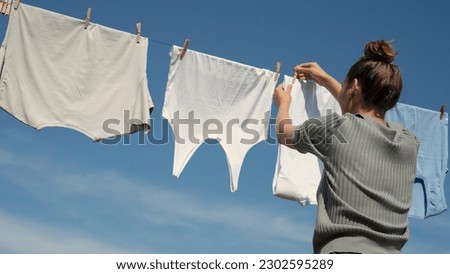 Similar – Image, Stock Photo hanging out the clothes outdoors